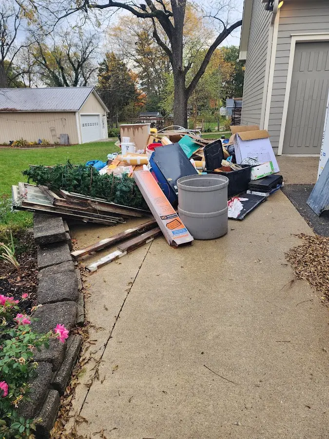 Dumpster being loaded with debris for 30 Yard Dumpster Rental in Williamstown